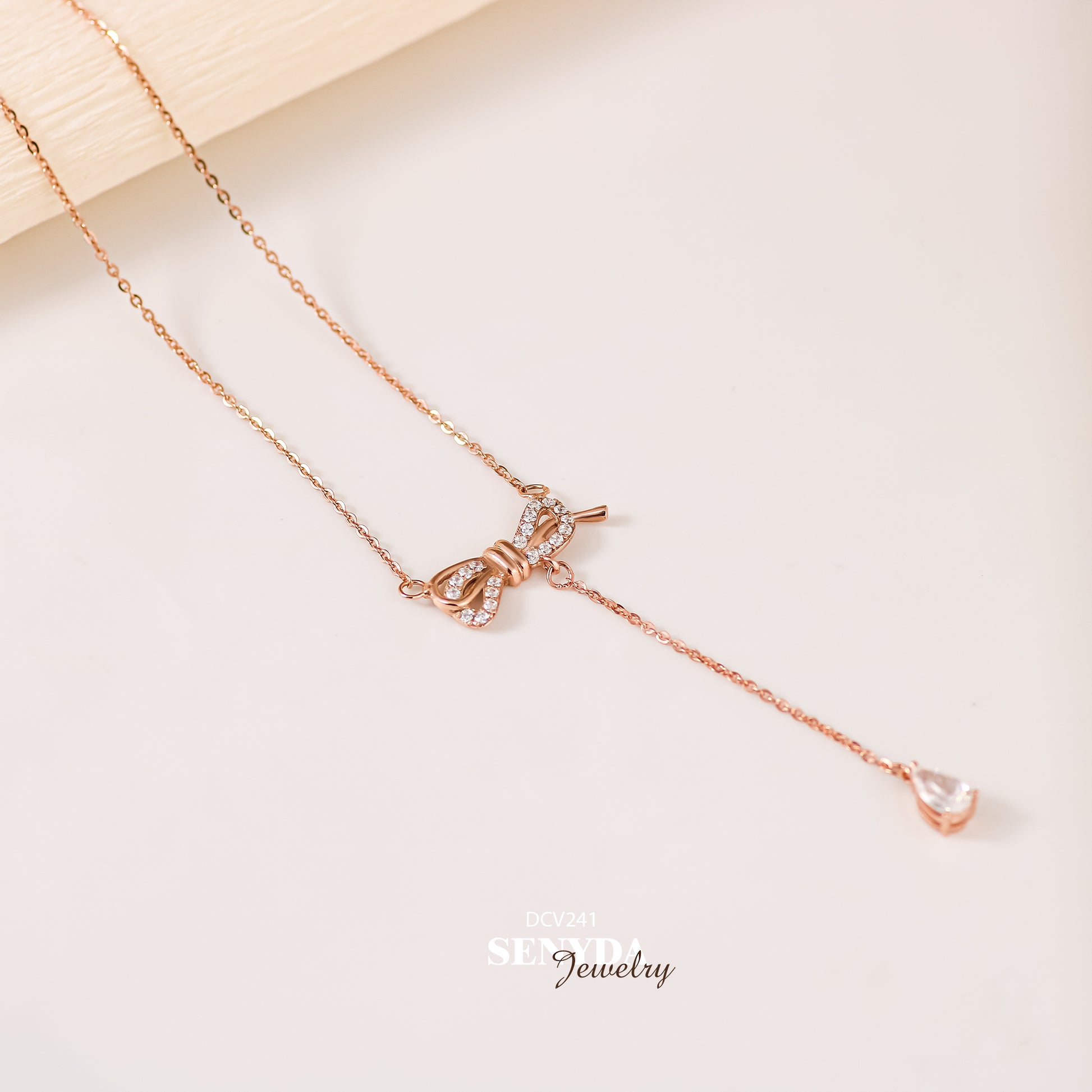 "Senyda 10K Solid Gold Bow Drop Lariat Necklace - Elegant and Stylish 10K Gold Bow Lariat Necklace with Delicate Drop Design."